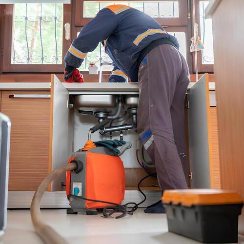 plumber providing drain services